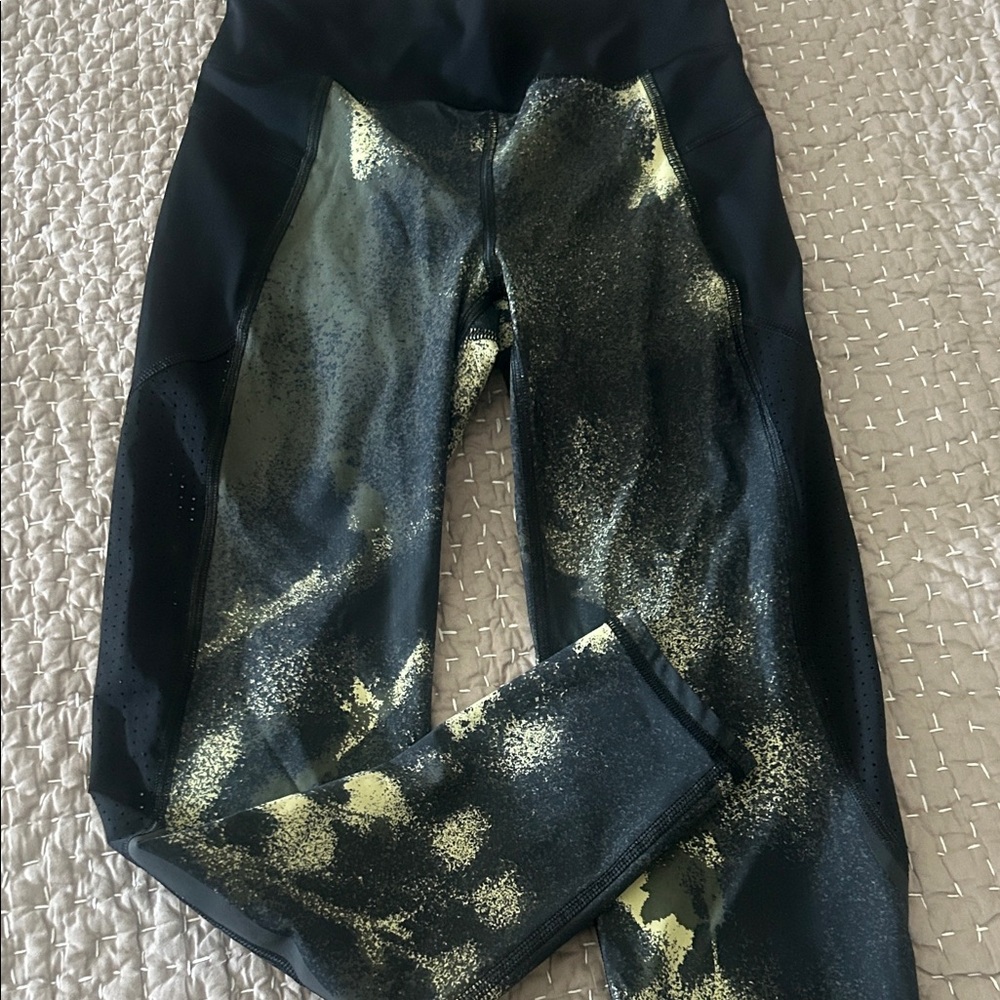 Sweaty Betty Black Leggings with Gold Splatter Design- zip picket- retails @ 118